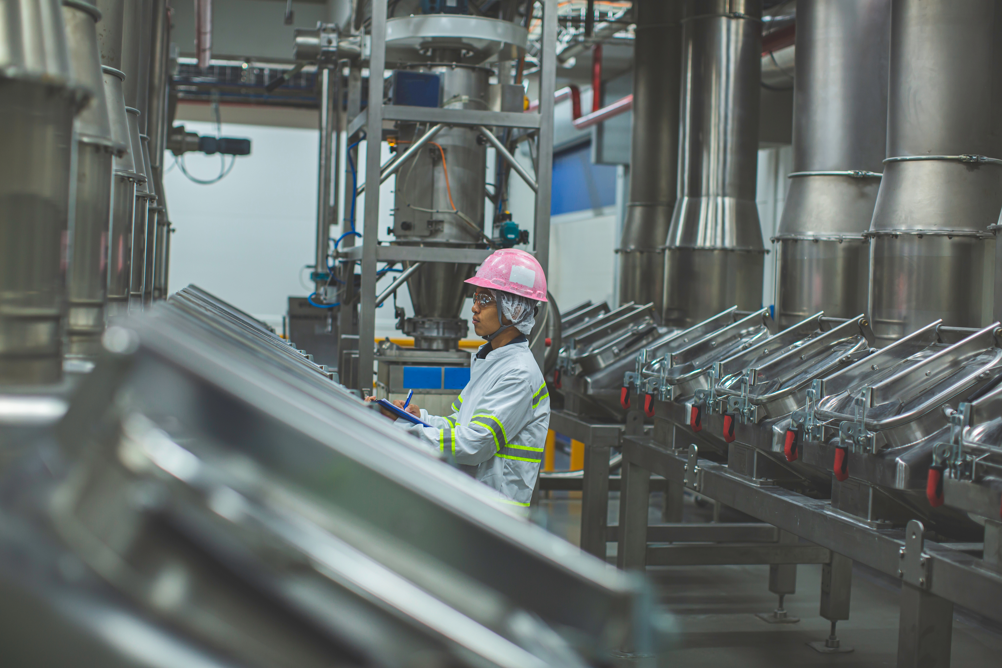 Male work inspection process milk powder cellar at the with vert