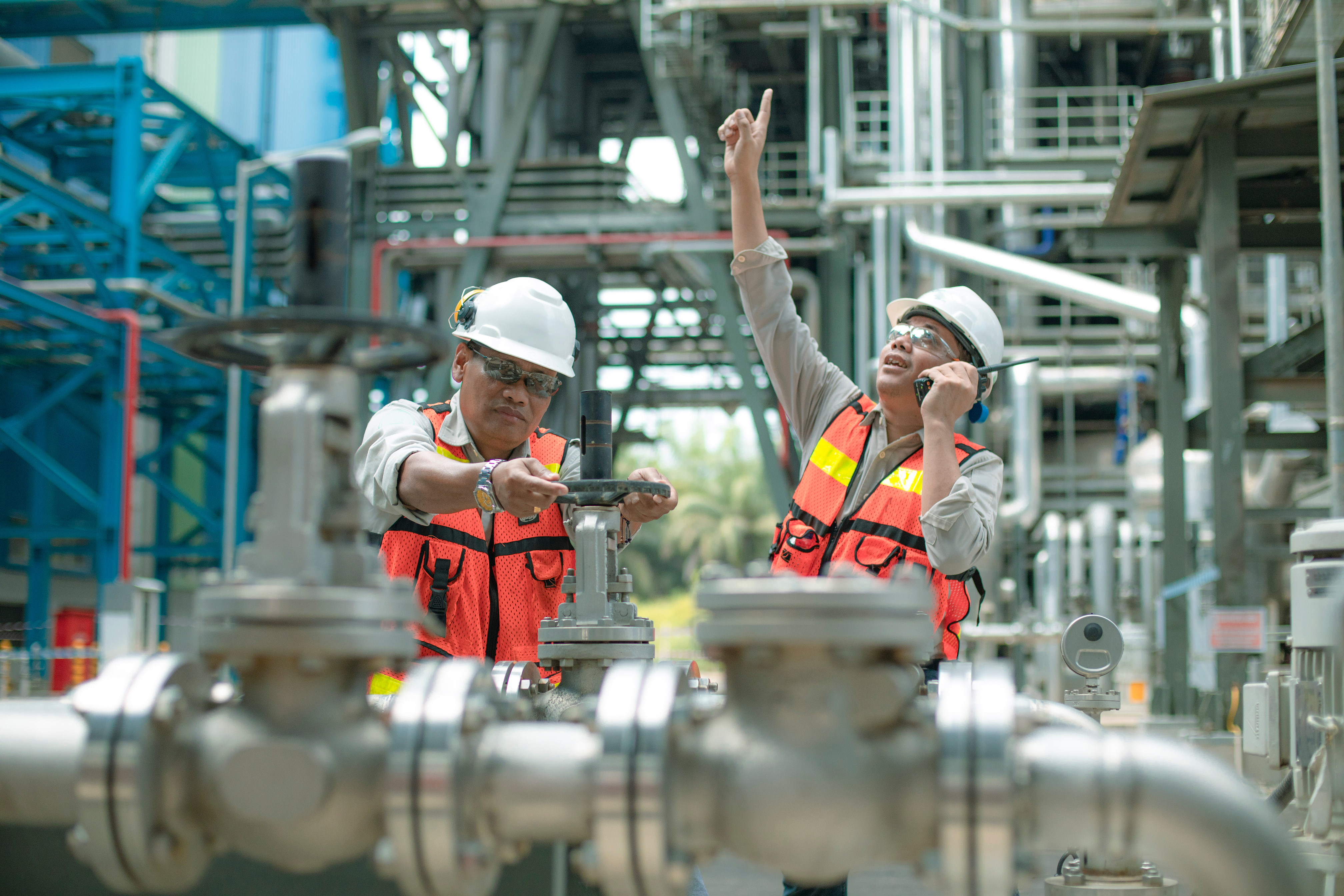 electricity engineer and his supervisor at industrial facility